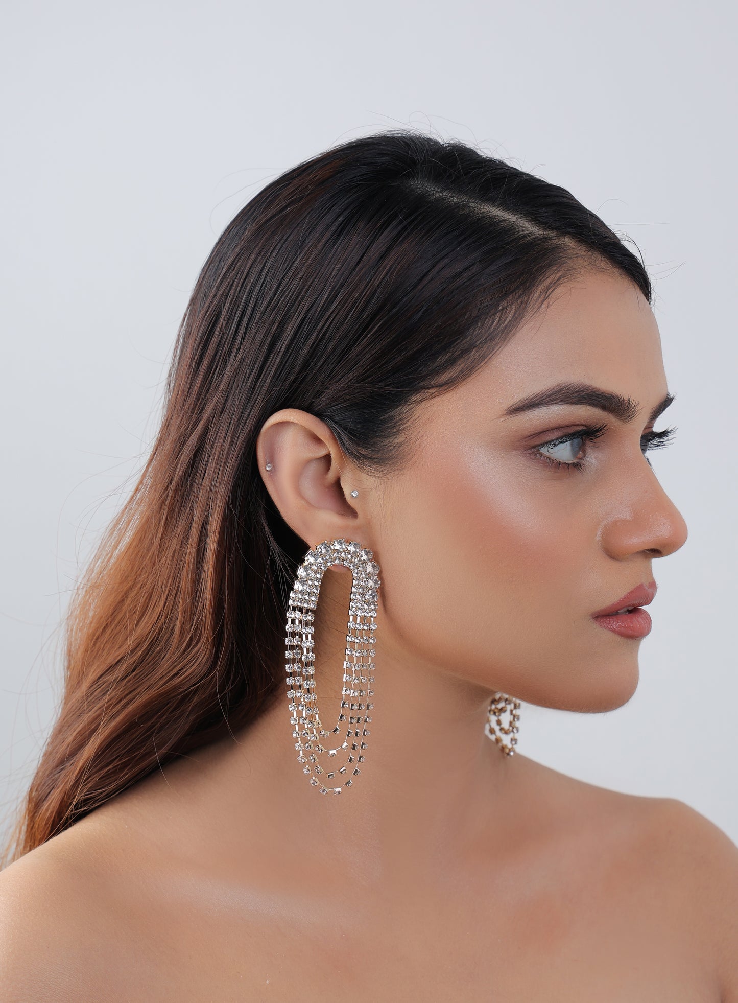 A Layer After Layer Crystal Earrings In Golden